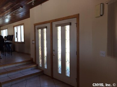 Foyer. The leaded panels in the front door create 