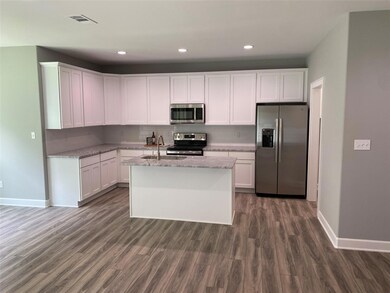 Kitchen with appliances with stainless steel finis