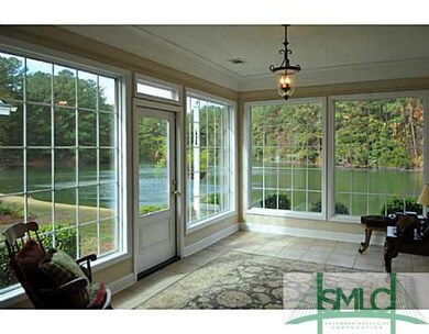 Sunroom. What a beautiful view with the all glass 