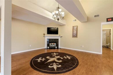Additional view of living room with vaulted ceilin