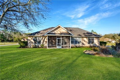 Enjoy the screened porch overlooking the backyard