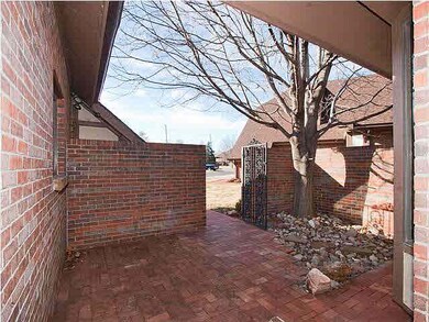 brick courtyard and iron gate