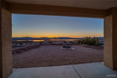 Patio terrace at dusk with a mountain view