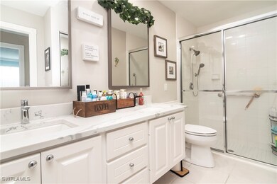 Full bath featuring a stall shower, tile patterned