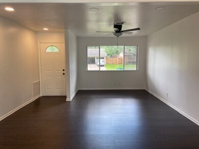 Formal Living and Dining with New paint, New Flooring, New Light fixtures.