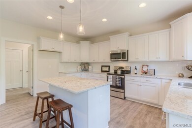 Kitchen has Large Island, Pendant Lighting, Granit