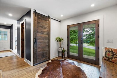 Bright foyer with storage and wide plank floors.