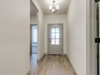 Doorway featuring light hardwood / wood-style floo