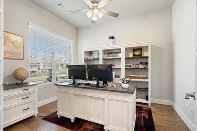 Home office with a wealth of natural light, dark w