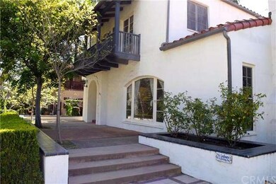 Spacious front patio, luscious green grass and flo