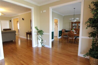 Open inviting foyer with hardwood floors