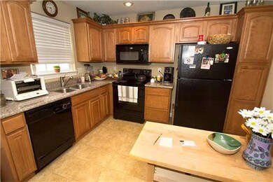 Appliances include the refrigerator, range, built-