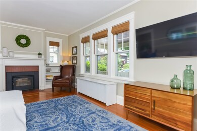 Living room with wood-burning fireplace.