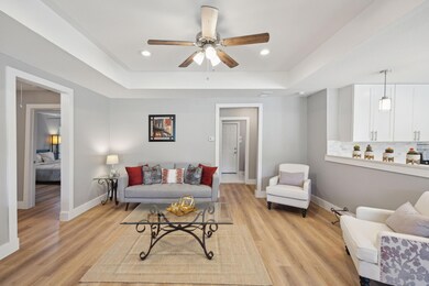 Living room with light hardwood / wood-style floor