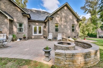 Close up view of rear patio with stone accent wall