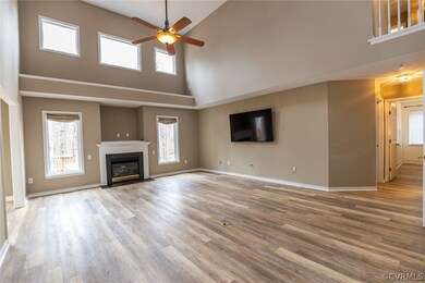 Vacant image of vaulted family room with laminate