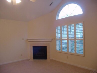 gas fireplace with ceramic tile hearth and surroun