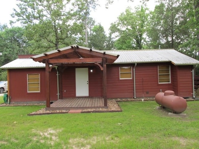 Back View of Home with covered Pergola.