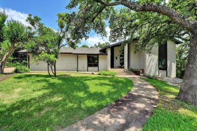 Mid-century modern home with a front yard
