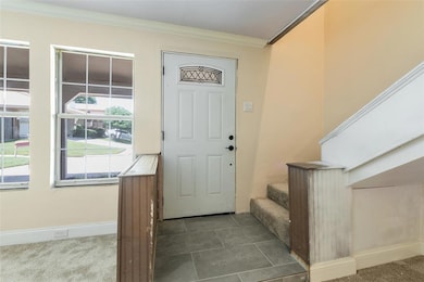 Entryway Opens to Large Living Area and access to 
