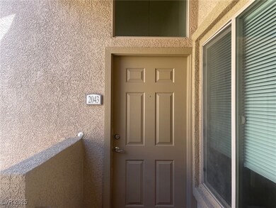 Entrance to property featuring stucco siding