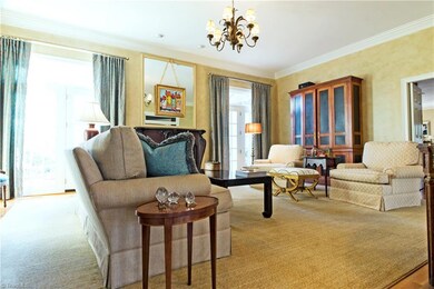 Living Room with 2 sets of French doors leading to Terrace /French carved mantle / gas logs