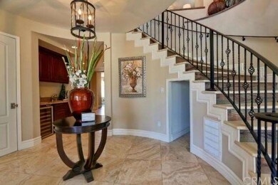 Spacious circular foyer framed by dramatic marble 