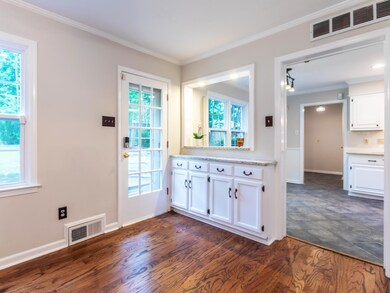 Kitchen featuring a wealth of natural light, dark 