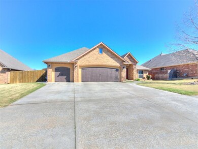 Single story home featuring a front lawn and a gar
