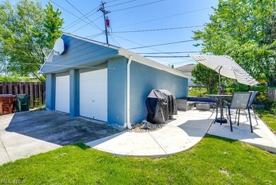 Garage featuring a yard