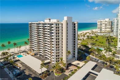 View of building exterior featuring a beach view a