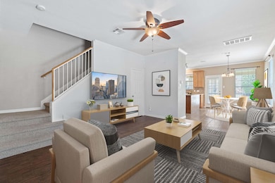 Living area featuring a ceiling fan, crown moldin