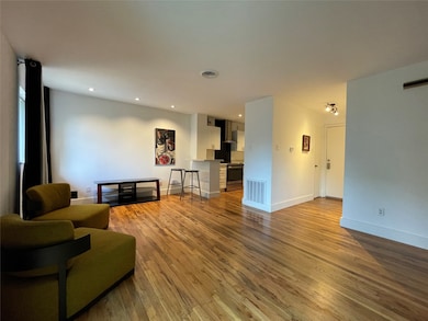 Beautiful hardwood floors throughout the open layo