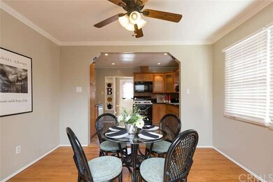 Formal dining room with hardwood floors and crown 