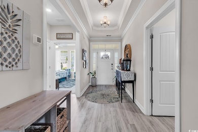 Entrance foyer with baseboards, light wood finishe