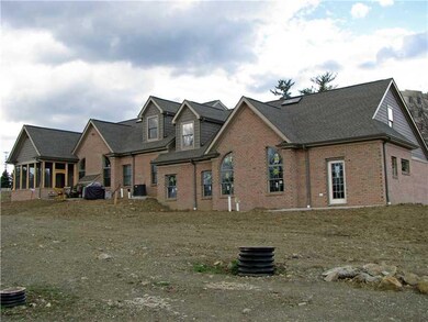 Exterior Back. Rear elevations show patio on one m