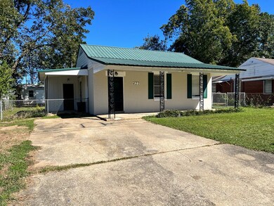 Parking pad and side gates to back yard