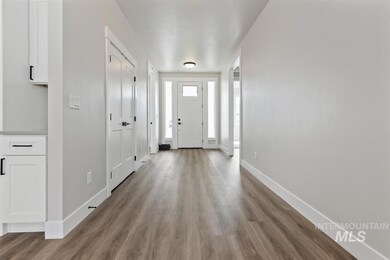 Entryway with wood finished floors