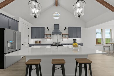 Kitchen with vast island & floating shelves