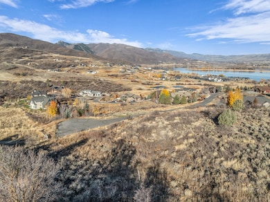 View of mountain background with a large body of water and nearby suburban area