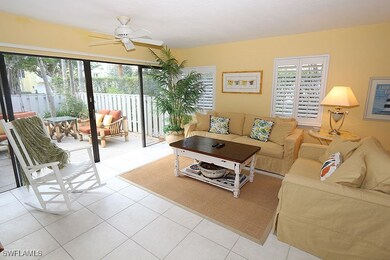 Living area featuring a ceiling fan, plenty of nat