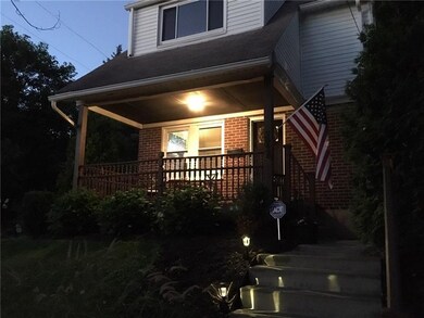 Just imagine sitting on this beautiful front porch watching time go by on a warm Summer's evening.  Dog in window not included (sorry).