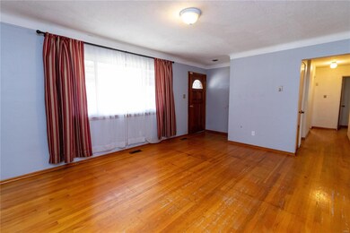 Wood floors and coved ceiling in the living room