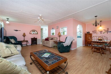 Living room has large windows to let in lots of natural light.