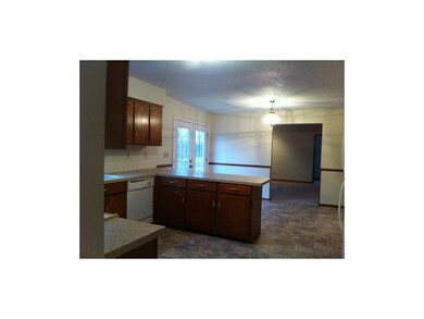Kitchen features dining area and breakfast counter