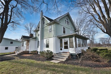 Enclosed 3 season front porch, freshly painted! Be