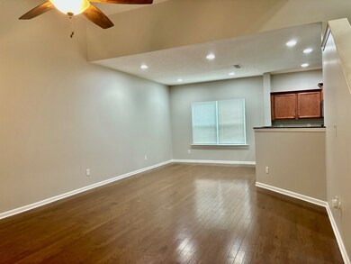 The beautiful hardwood floors and fresh paint make this a welcoming room with an open floor plan.