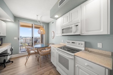 BREAKFAST AREA AND DESK IN KITCHEN - LEADS TO BALCONY 2