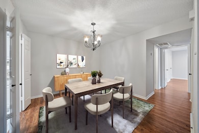 Virtually staged dining area connects easily to the kitchen and living spaces ideal for entertaining
