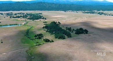 Overview of rural landscape featuring a mountain backdrop